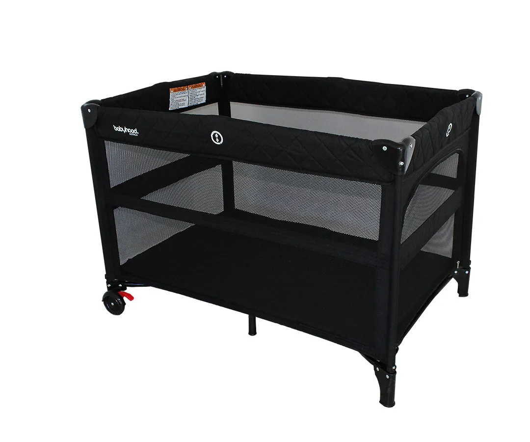 Babyhood Bambino Dormire shown in its lower porta cot mode with mesh sides