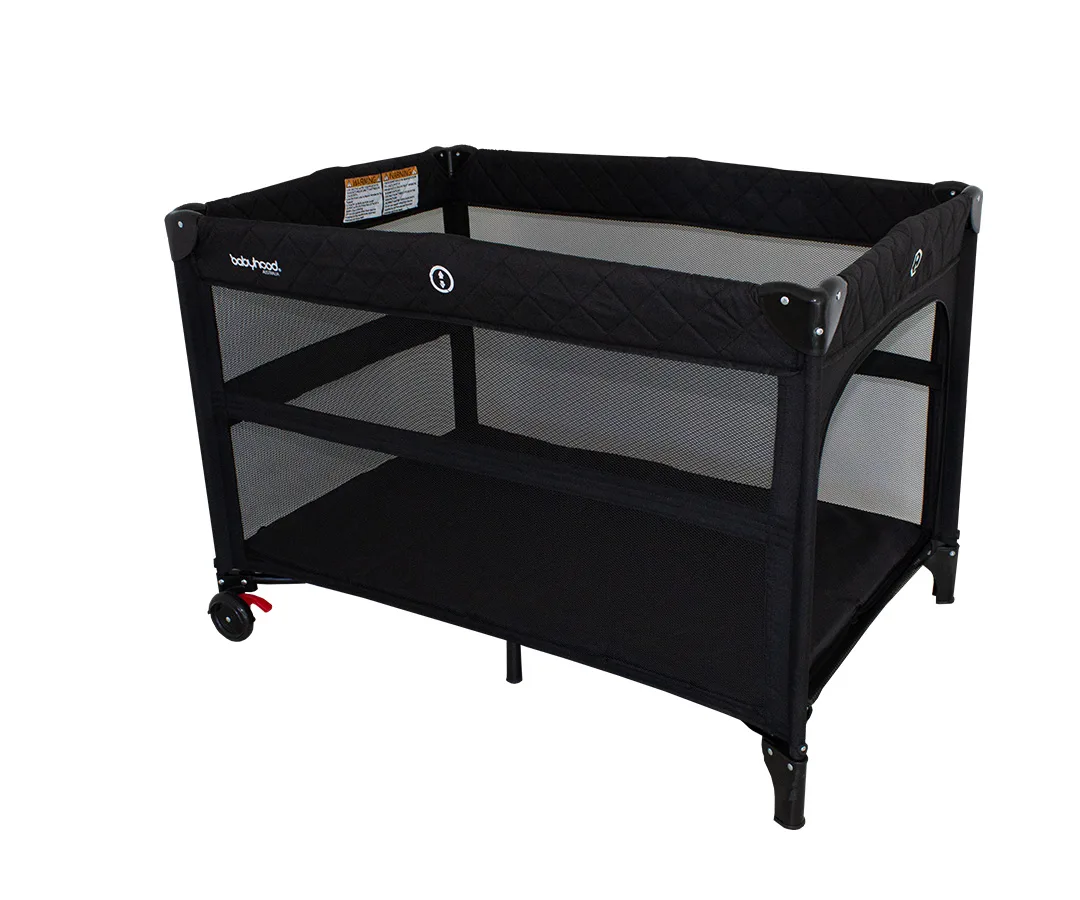 Bambino Dormire porta cot folded beside its black carry bag