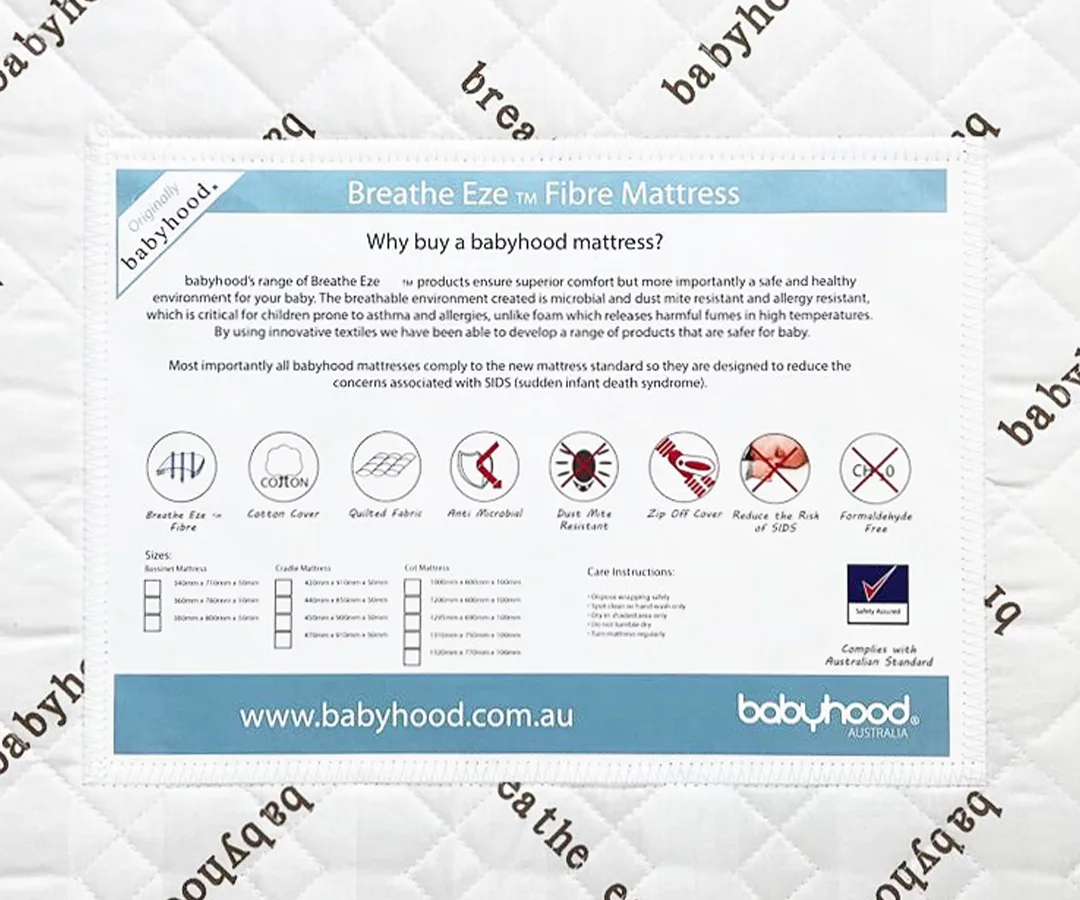 Babyhood Breathe Eze mattress opened to show its removable cover and white fibre core