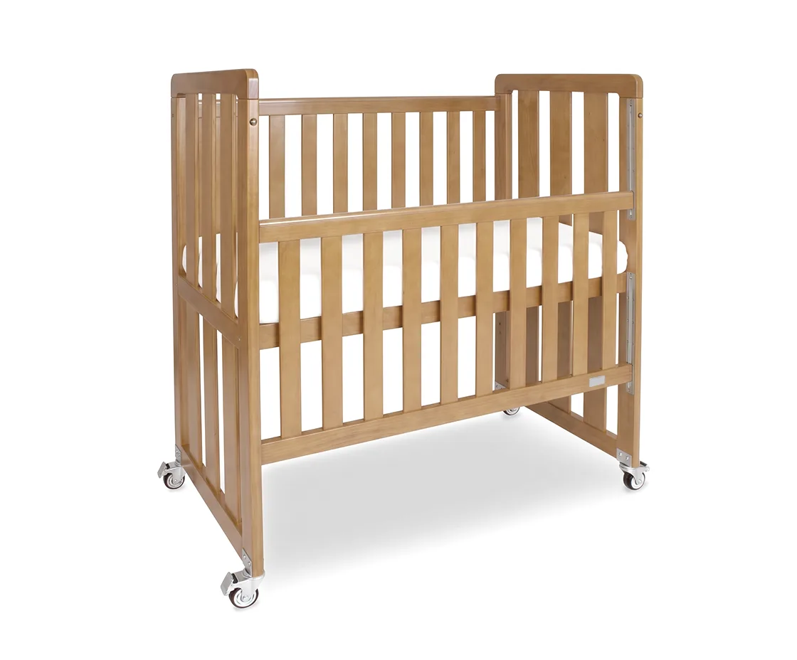 Babyhood Ergonomic Cot shown on four heavy-duty locking castors