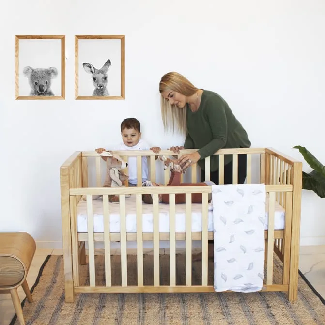 Natural timber Babyhood Lulu Cot in a nursery