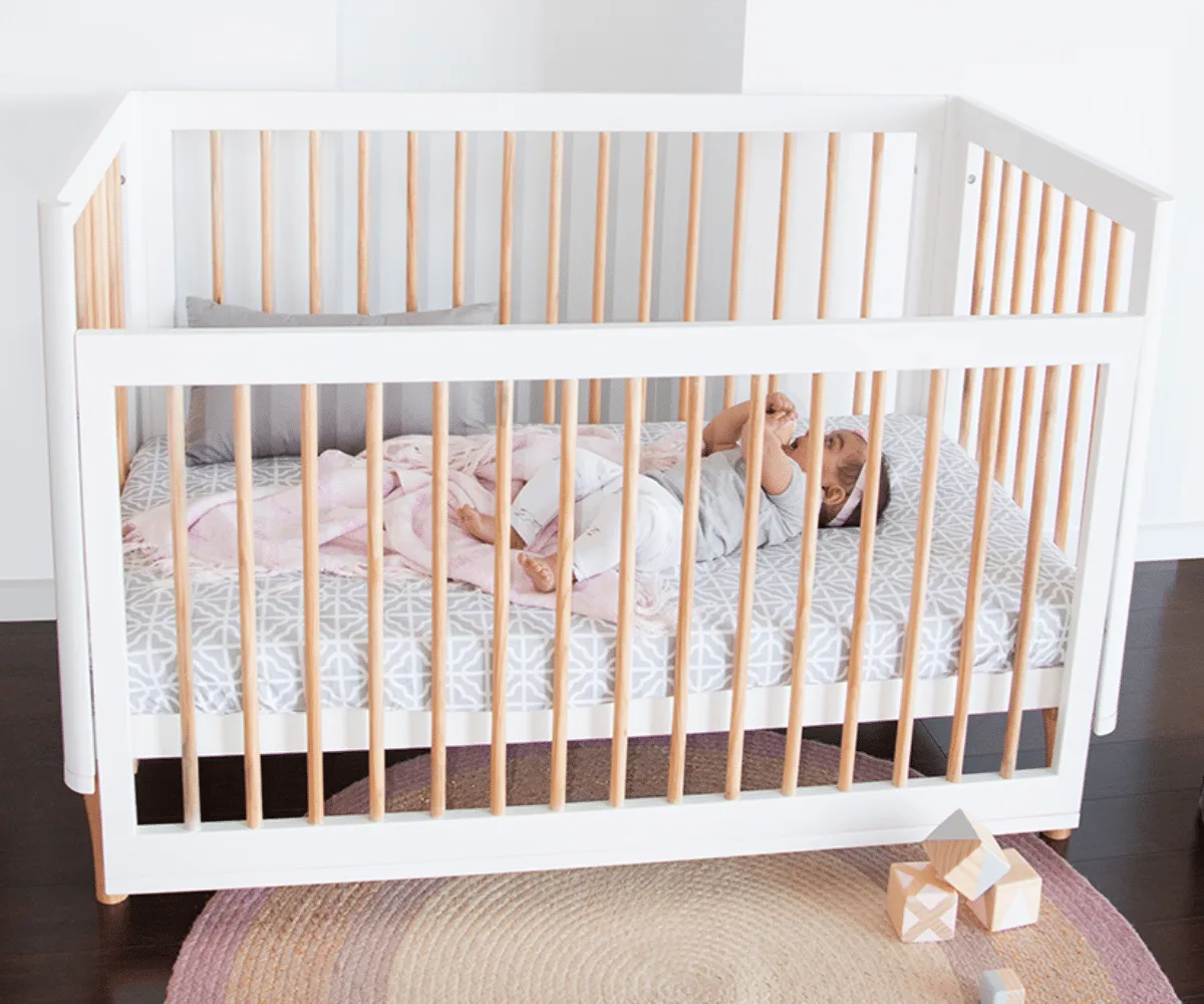 Babyhood Riya Cot shown in its natural timber finish