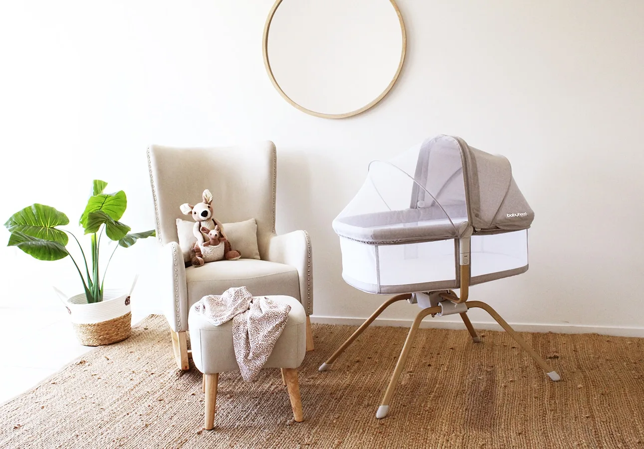 Babyhood Rocking Travel Bassinet viewed from the side with mesh panels visible
