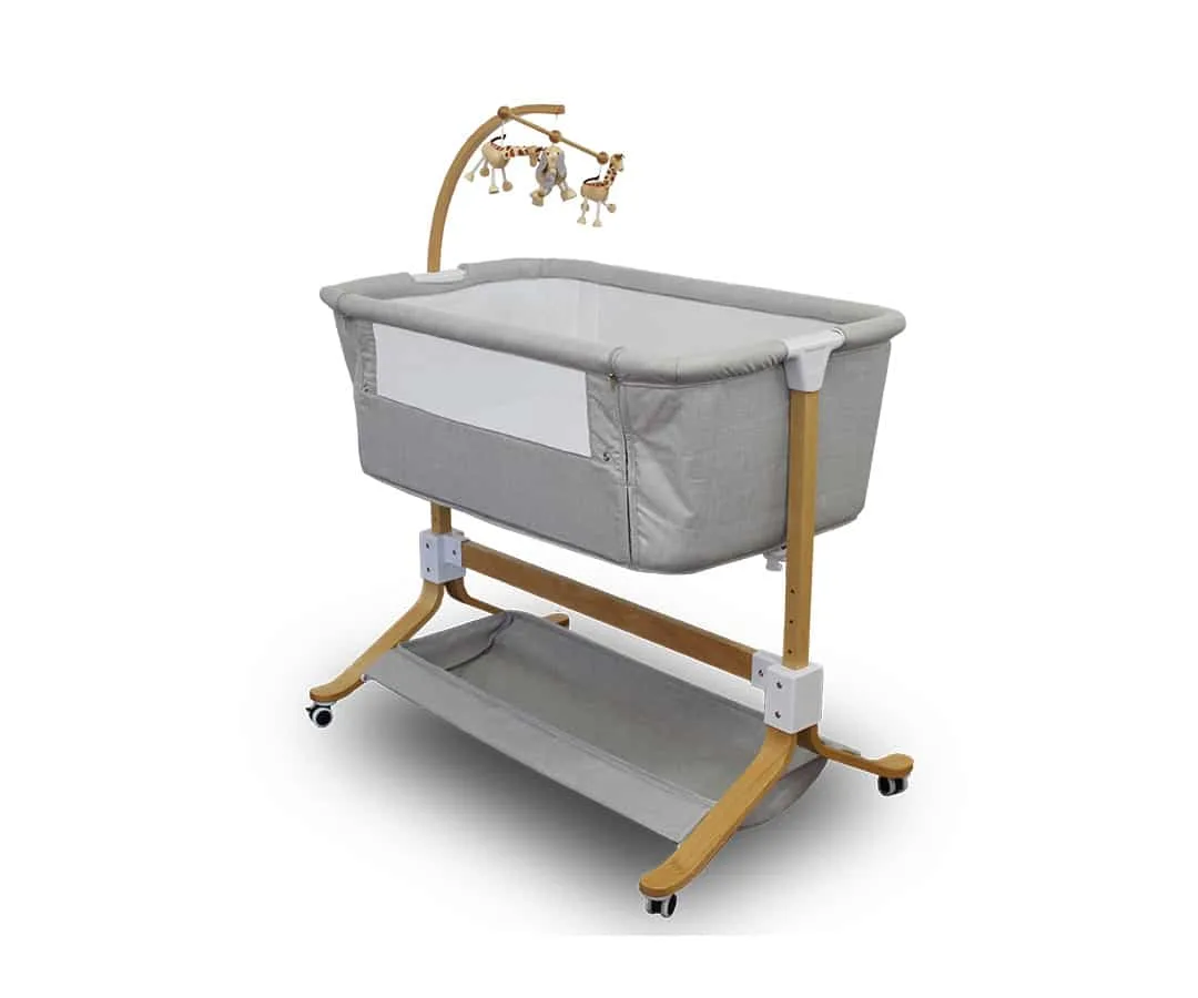 Kaylula Co Sleeper Cradle shown with mesh side and raised barrier