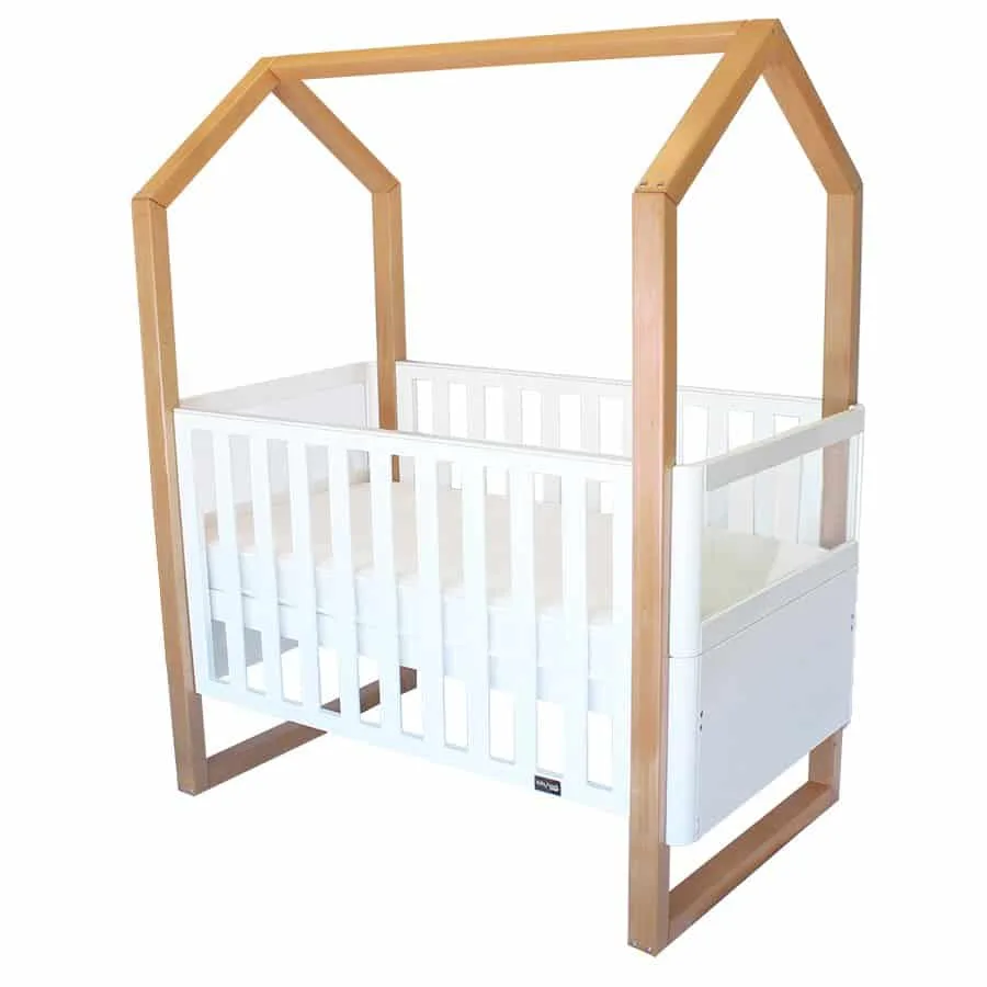Kaylula Mila Cot showing its clear side panel and lowering front rail